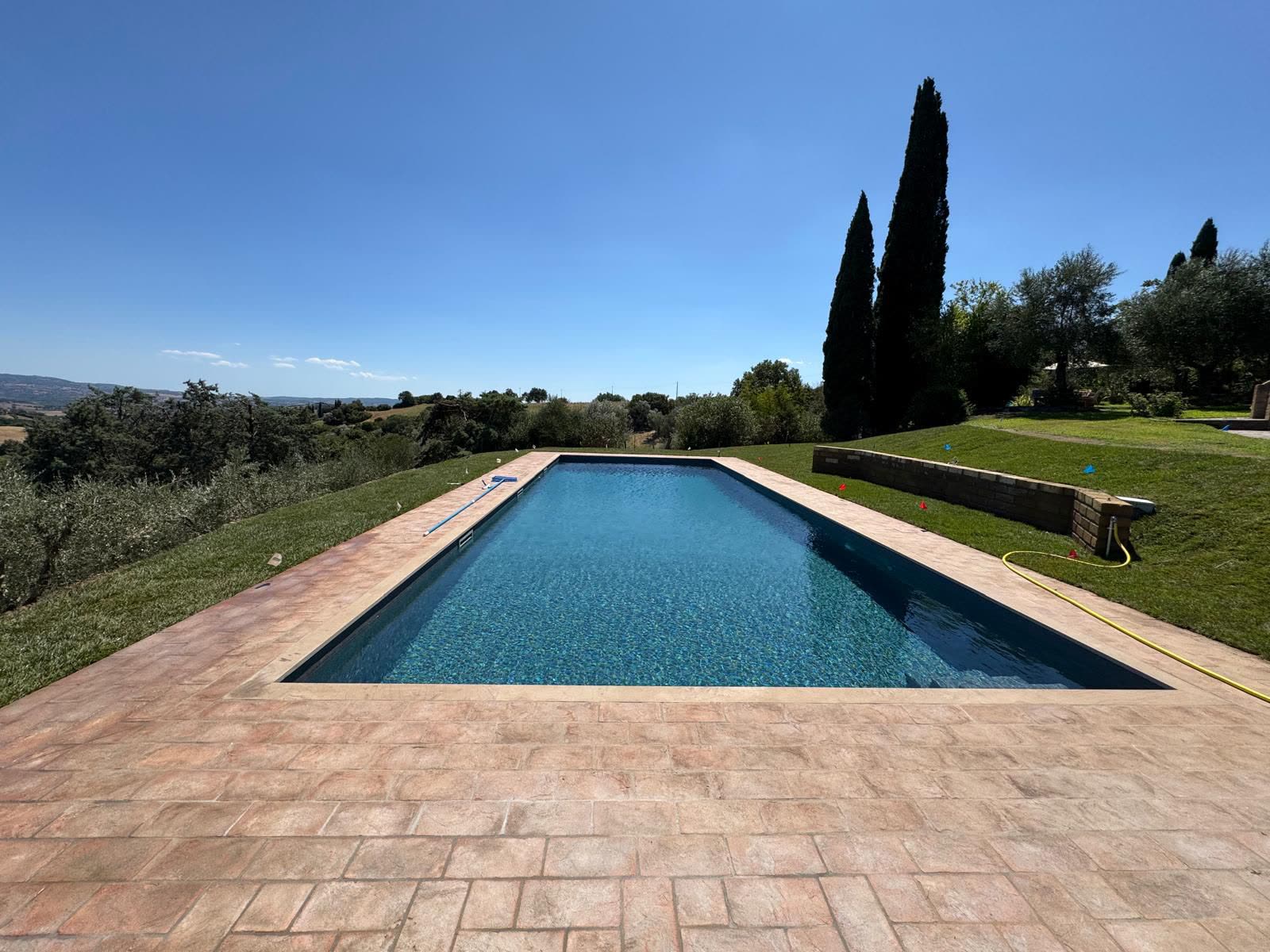 The private saltwater pool looking out over olive trees and the valley beyond